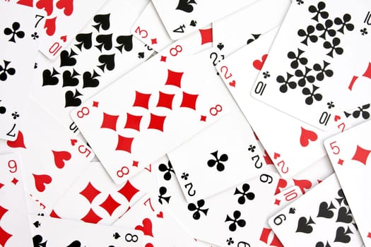 background made with playing cards randomly displaced