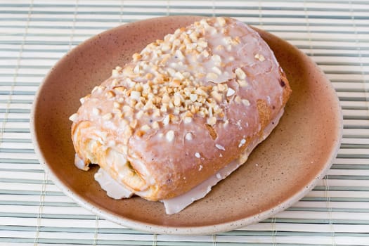 cream cake with bits of nuts on the top