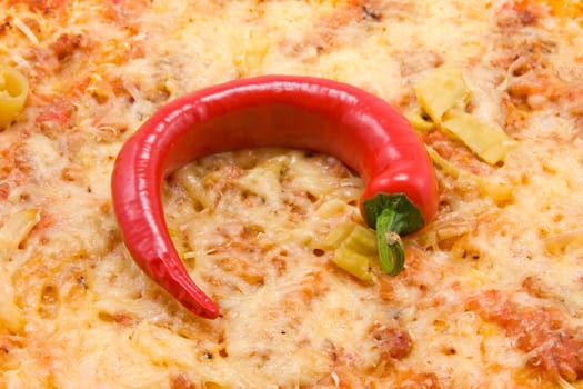 Close up of pizza with red chili pepper