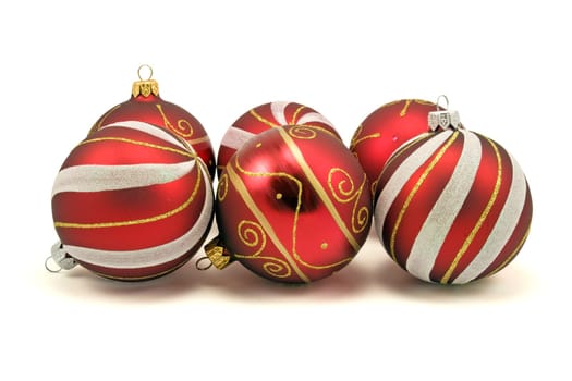 set of christmas baubles over a white background