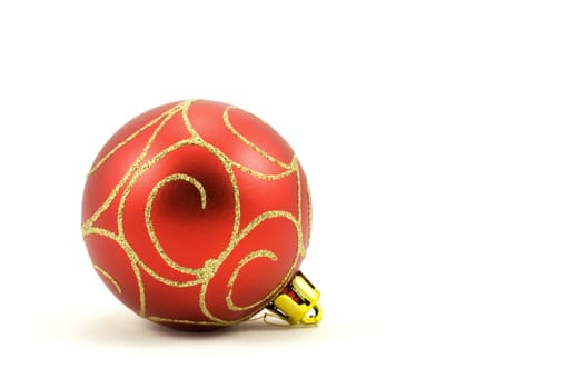 red christmas ball with ornament. Isolated on white