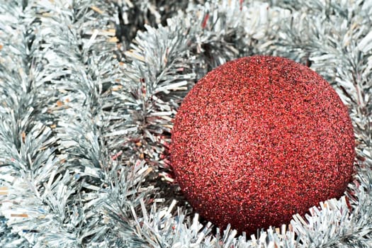 red christmas tree ball on silver decorations