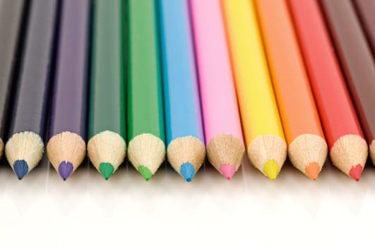 set of colored pencils on white background