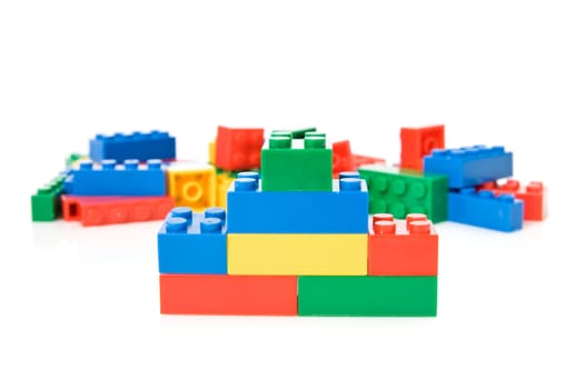 colorful plastic toys over a white background