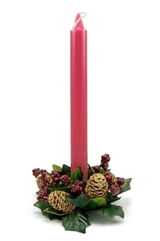 Traditional Christmas red candle on white background
