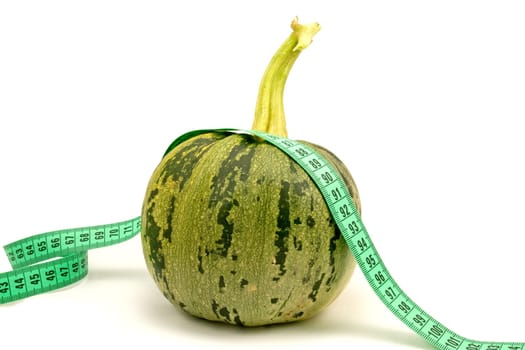 diet and nutrition. zucchini with measuring tape