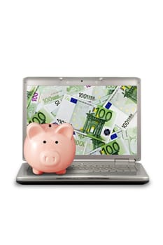 e-commerce concept. piggy bank and computer with money&#039 s screen.