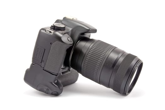 photo camera with battery grip and lens