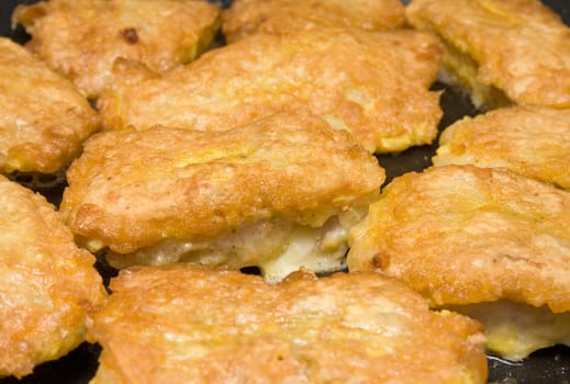 fish fillets roasting in the frying pan