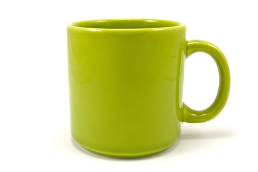 green ceramic teacup isolated on white background