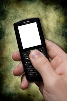 hand with black mobile phone on dark background