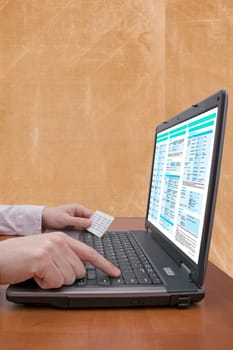 internet banking concept. hands holding code card