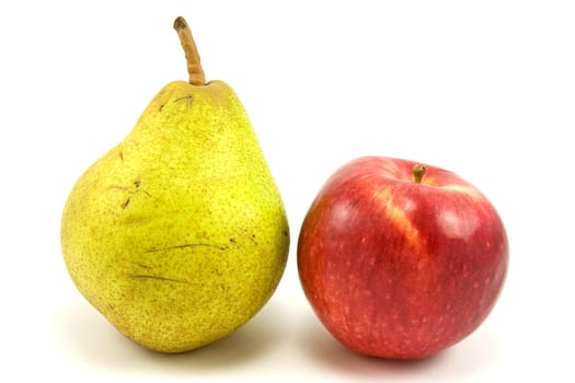 green pear and red apple on white background