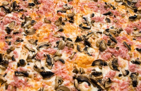 close-up of Pizza with Ham and Mushrooms