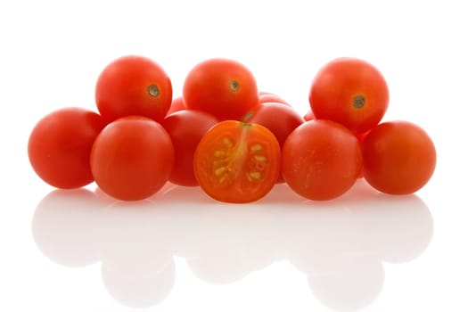 pile of cherry tomatoes on white background