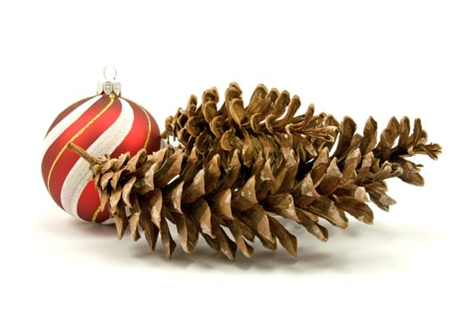 pine cones and christmas bauble on white background