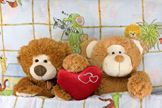 couple of passionate Teddy-bears lying in a bed