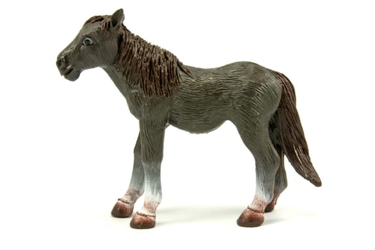 brown plastic horse isolated on white background