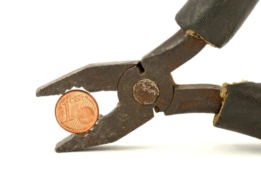 Euro cent squeezed in pliers, isolated on white background