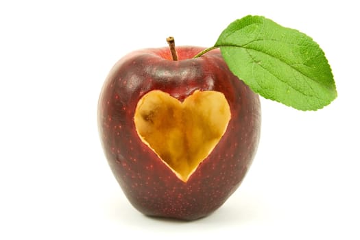 apple with a heart shape on it . isolated on white