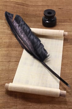 a papyrus scroll with inkwell and quill