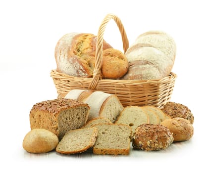 Composition with bread and rolls in wicker basket isolated on white