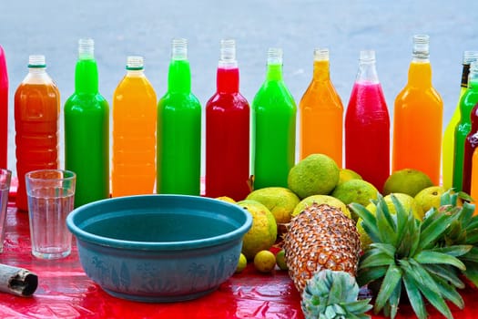 colorful fresh Fruit drinks are sold on the street with fruits in front