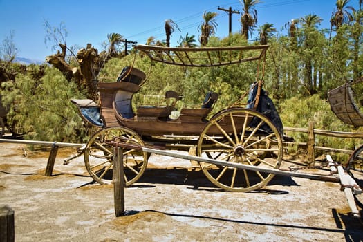 old wagon and coaches at the entrance of the Furnance Creek Ranch in the middle of Death Valley