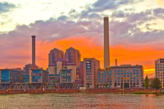 cityview of Frankfurt with river Main and new appartments and office buildings at the riverside at sunset