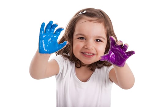 Little caucasian girl with hands painted in colorful paints