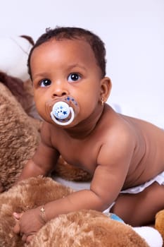 Adorable little african american baby girl  looking up