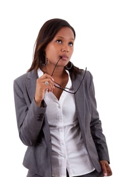 Thoughtful african american businness woman holding glasses , isolated on white background