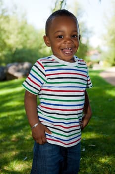 Cute little african american baby boy playing at park