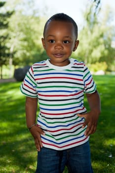 Cute little african american baby boy playing at park
