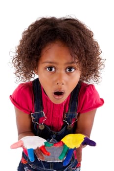 Little African Asian girl with painted hands in colorful paints