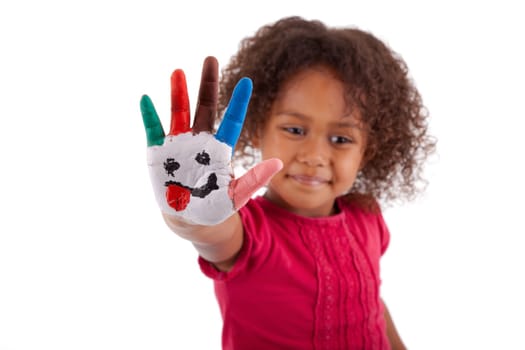 Little African Asian girl with painted hands in colorful paints