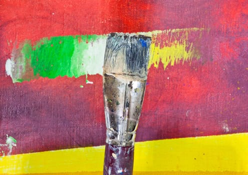 Paintbrushes on colorful background