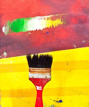Paintbrushes on colorful background