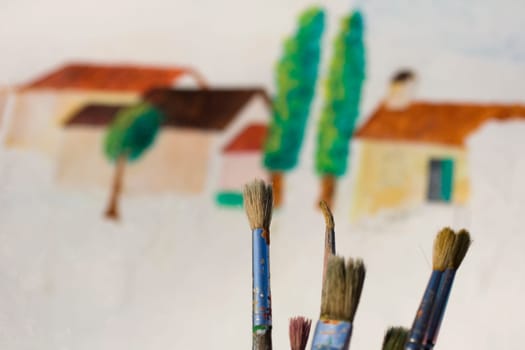 Paintbrushes on colorful background
