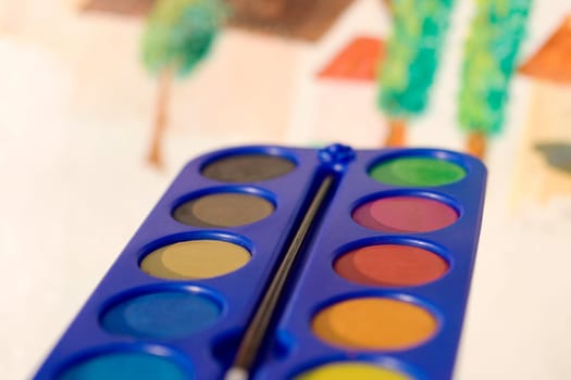 Photo of watercolors on painted canvas