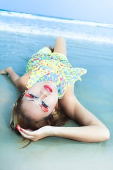 Beautiful asian model posing on the beach