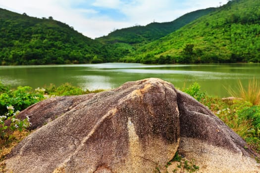 Beautiful lake in central Vietnam. Rock on foreground
