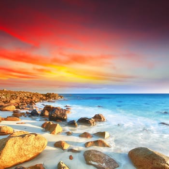 Sunrise over the sea. Stone on the foreground