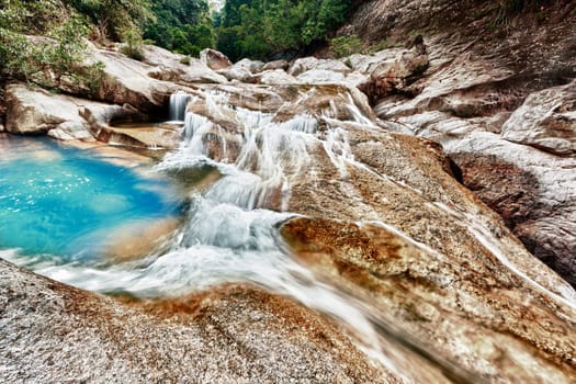 Beautiful waterfall at summer sunny day. Vietnam