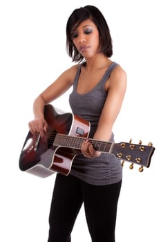 Young black woman playing guitar, isolated on white background