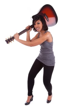 Young black woman breaking a guitar, isolated on white background