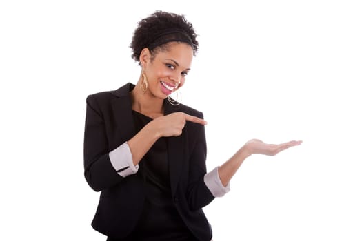 Young african american woman presenting something on empty palm, over white background