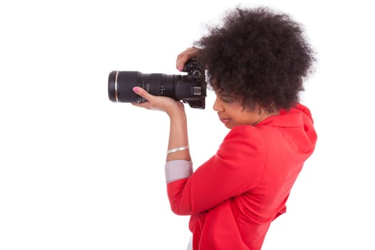 Young african american  photographer with camera, isolated on white background