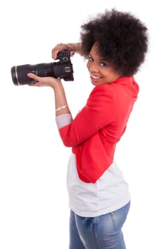 Young african american  photographer with camera, isolated on white background