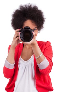 Young african american  photographer with camera, isolated on white background